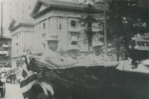 Henry Pittock riding in the Rose Festival parade circa 1917