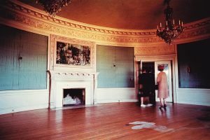 Stained wallpaper and damaged wood floors in the Music Room after the 1962 Columbus Day Storm