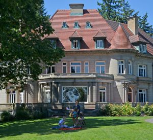 Family playing outside Pittock Mansion