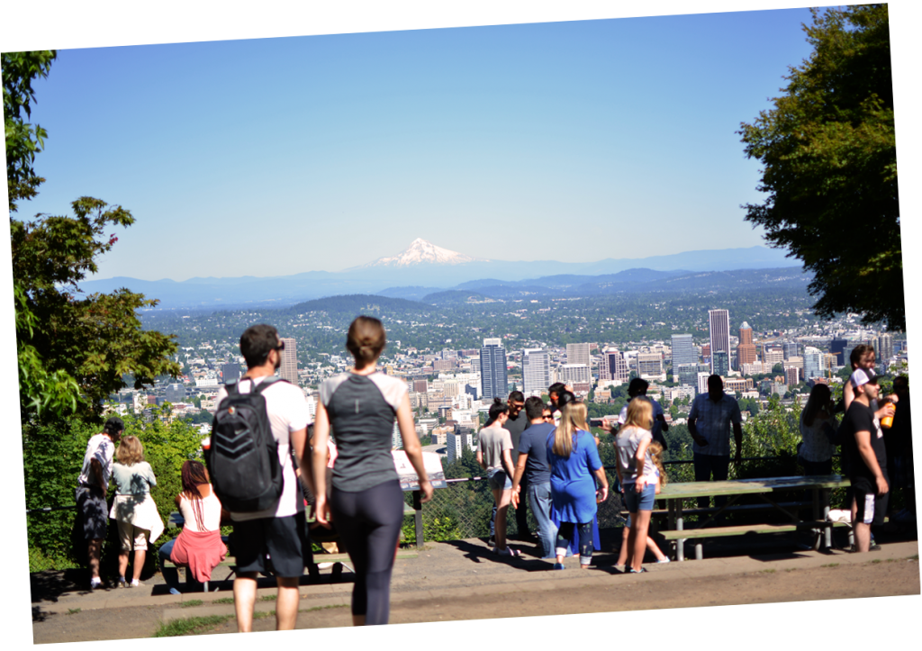 Visitors enjoying Pittock Mansion's view of Mount Hood and downtown Portland